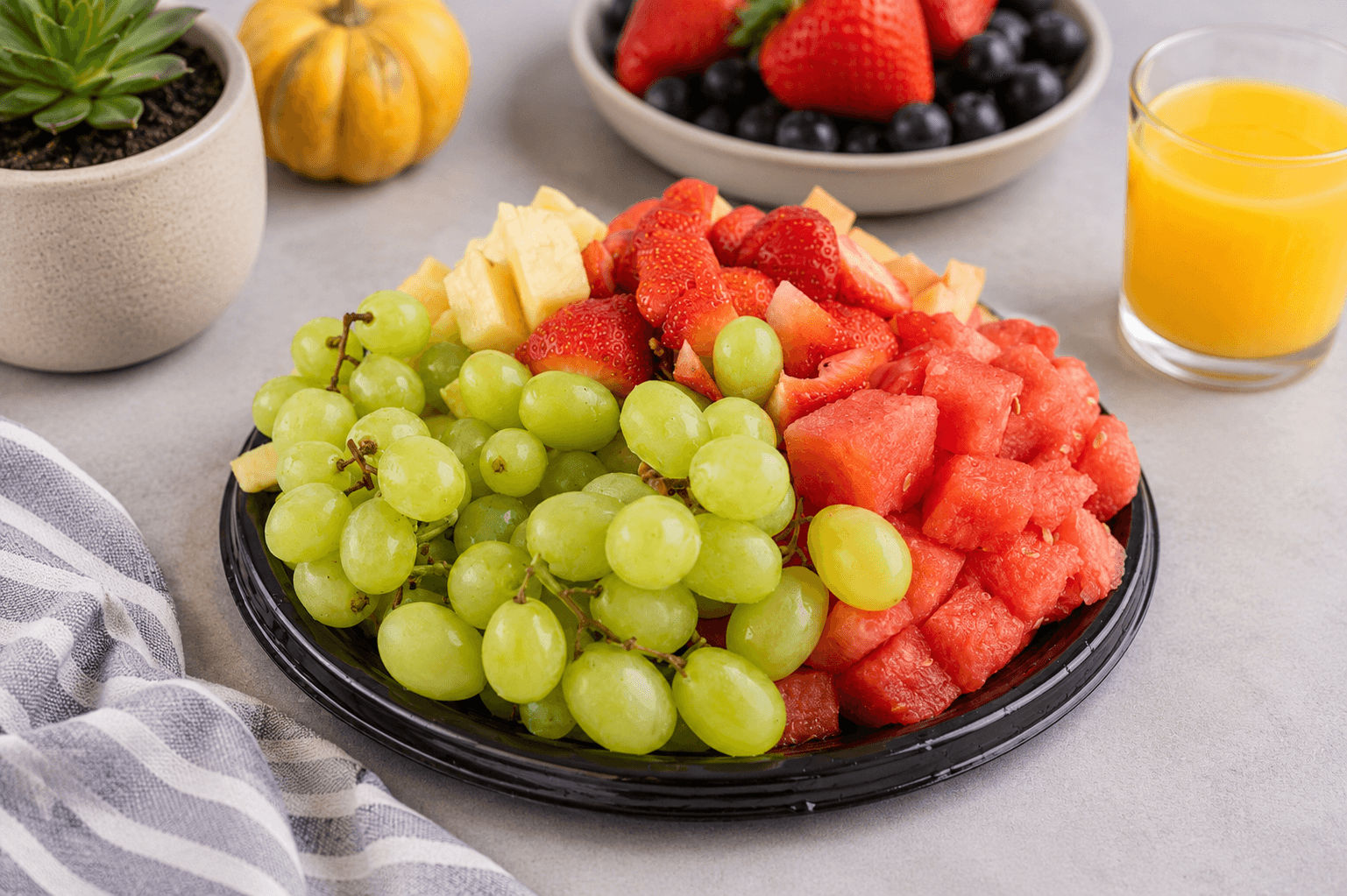A catering tray of fresh fruit and vegetables