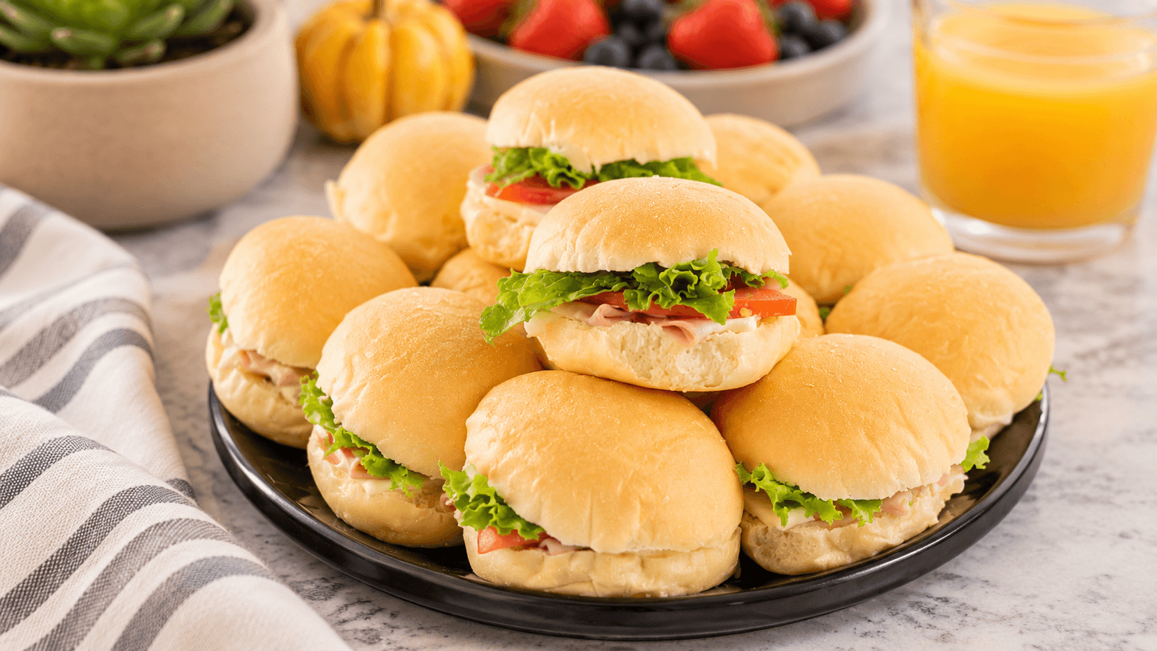 Slider sandwiches arranged on a catering tray